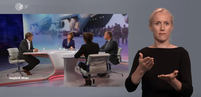 Gebärdendolmetscherin übersetzt die ZDF-Sendung "Maybrit Illner"