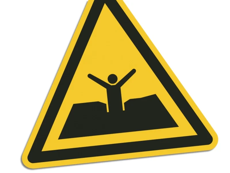 Warnschild mit Person, die feststeckt