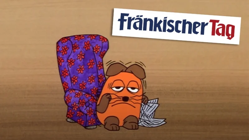 Die Maus beim Lesen des "Fränkischen Tags"
