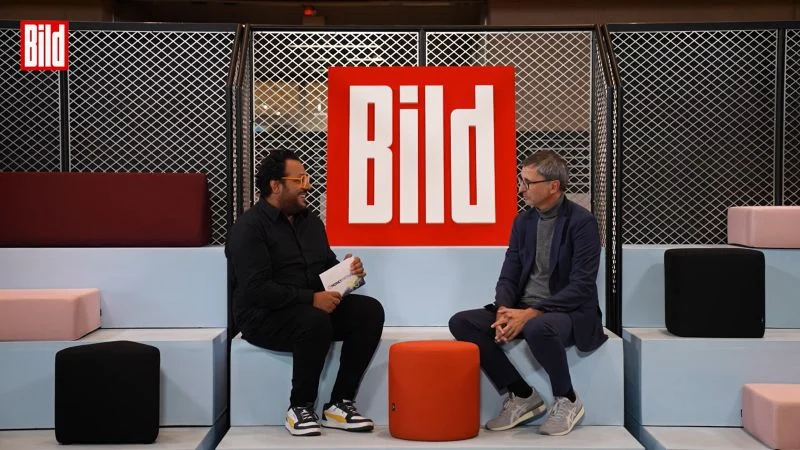 Bild-Moderator im Interview mit dem Chef der DKB