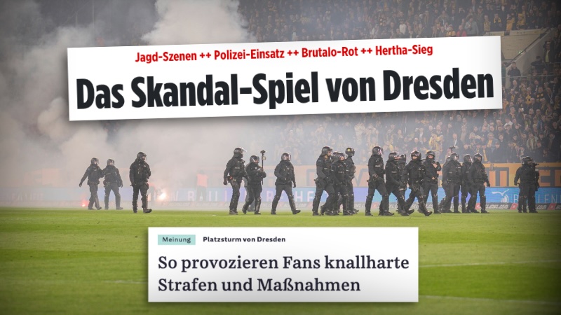 Polizei auf dem Spielfeld im Stadion von Dynamo Dresden am 4.4.2026, im Hintergrund viel Rauch.