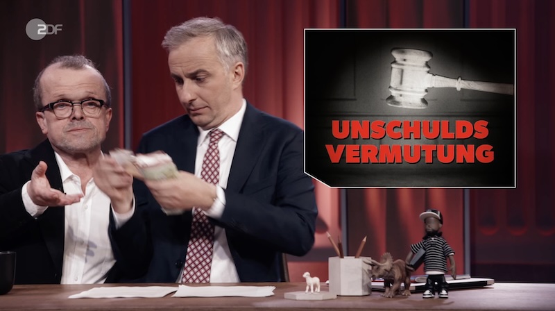 Szene auf dem „ZDF Magazin Royale“ vom 17.4.2026: Jan Böhmermann zählt Geldscheine in die Hand des „Scherzanwalts Dr. Christian Witz“.