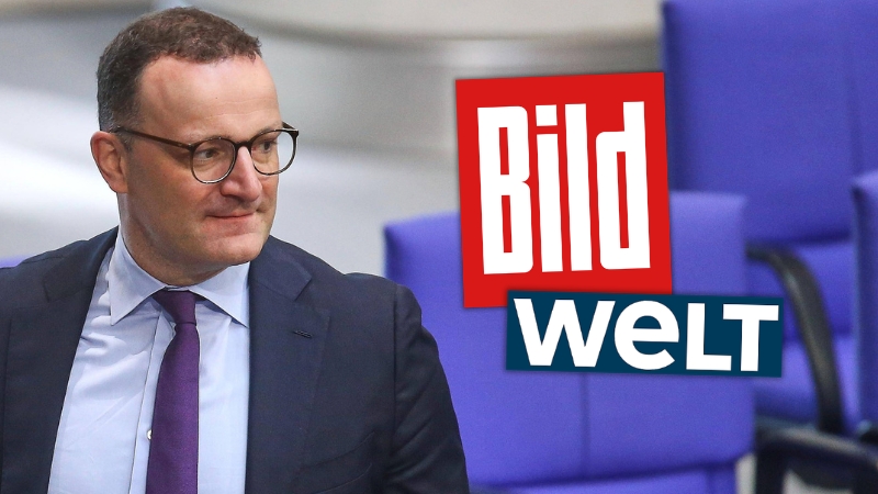 Jens Spahn guckt zur Seite, daneben die Logos von „Bild" und „Welt“
