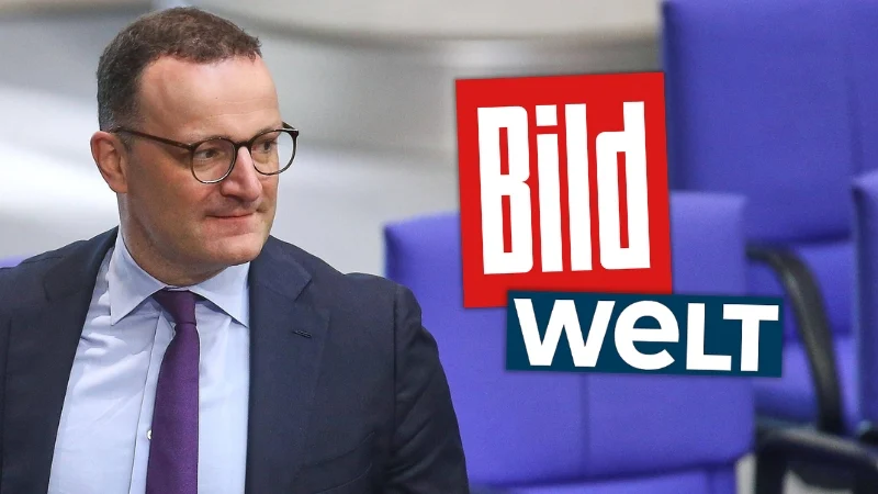 Jens Spahn guckt zur Seite, daneben die Logos von „Bild" und „Welt“